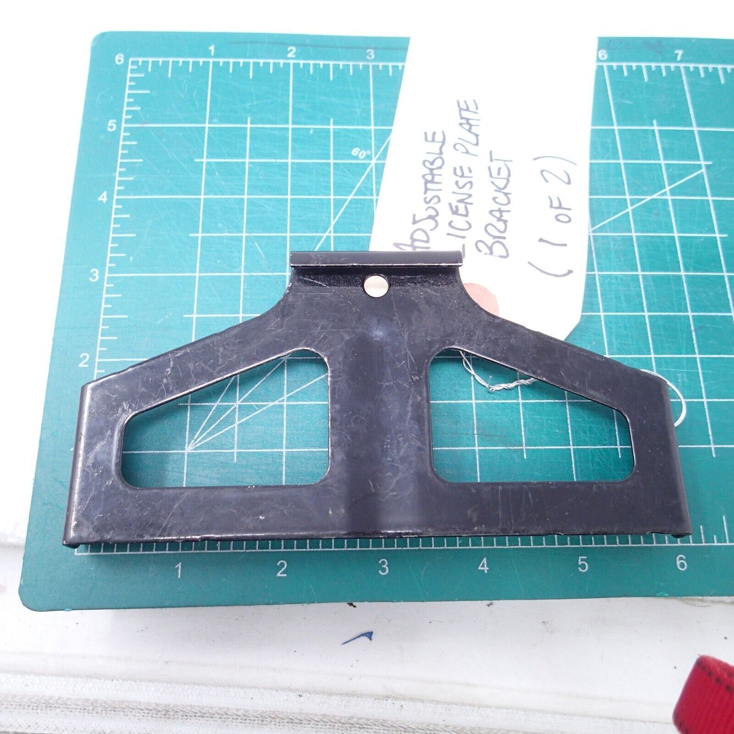 ADJUSTABLE LICENSE PLATE BRACKET