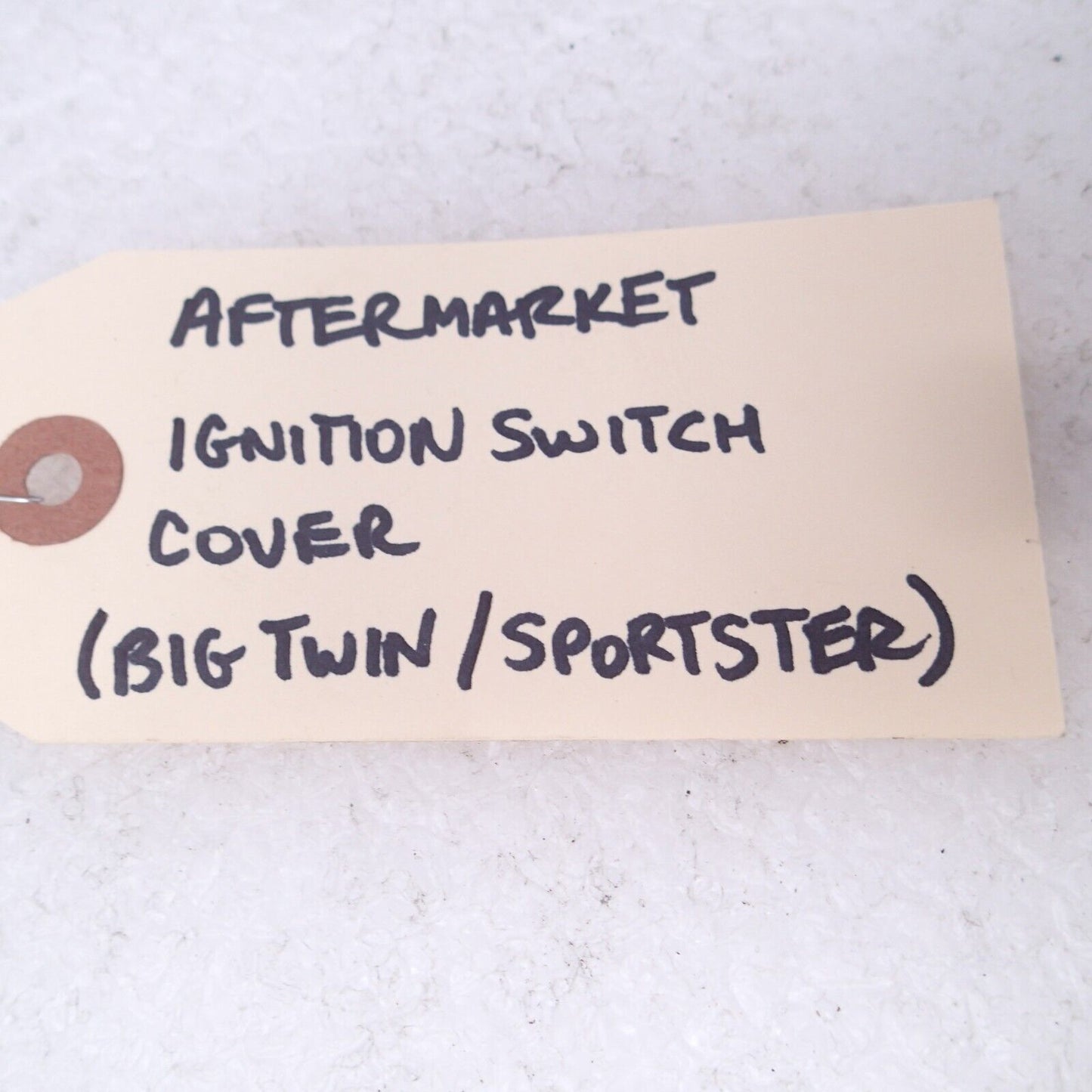 AFTERMARKET IGNITION SWITCH COVER (BIG TWIN/SPORTSTER)