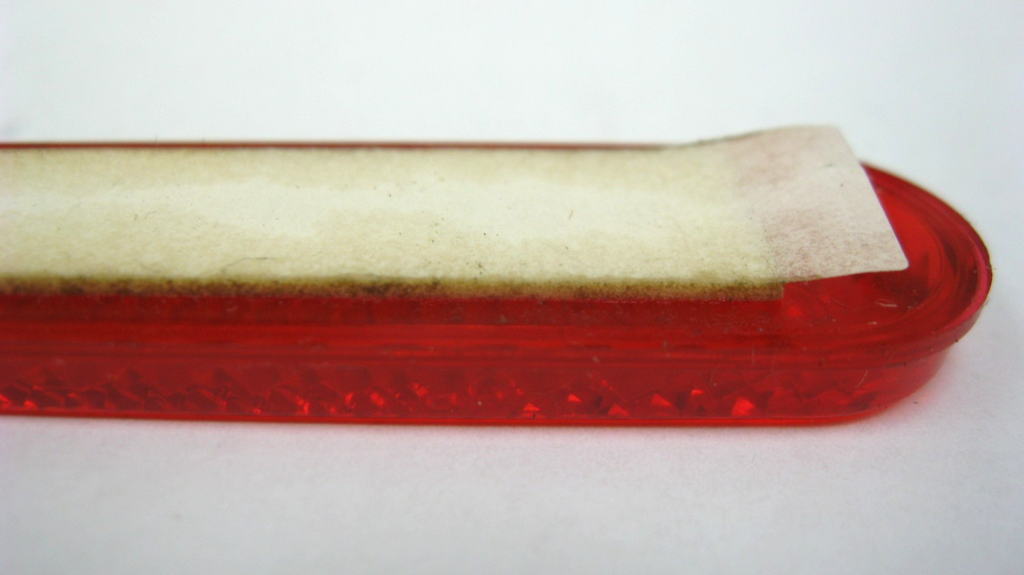 Harley-Davidson OEM 07 & Later Oblong Red Reflector (Tape Soiled) 69490-07