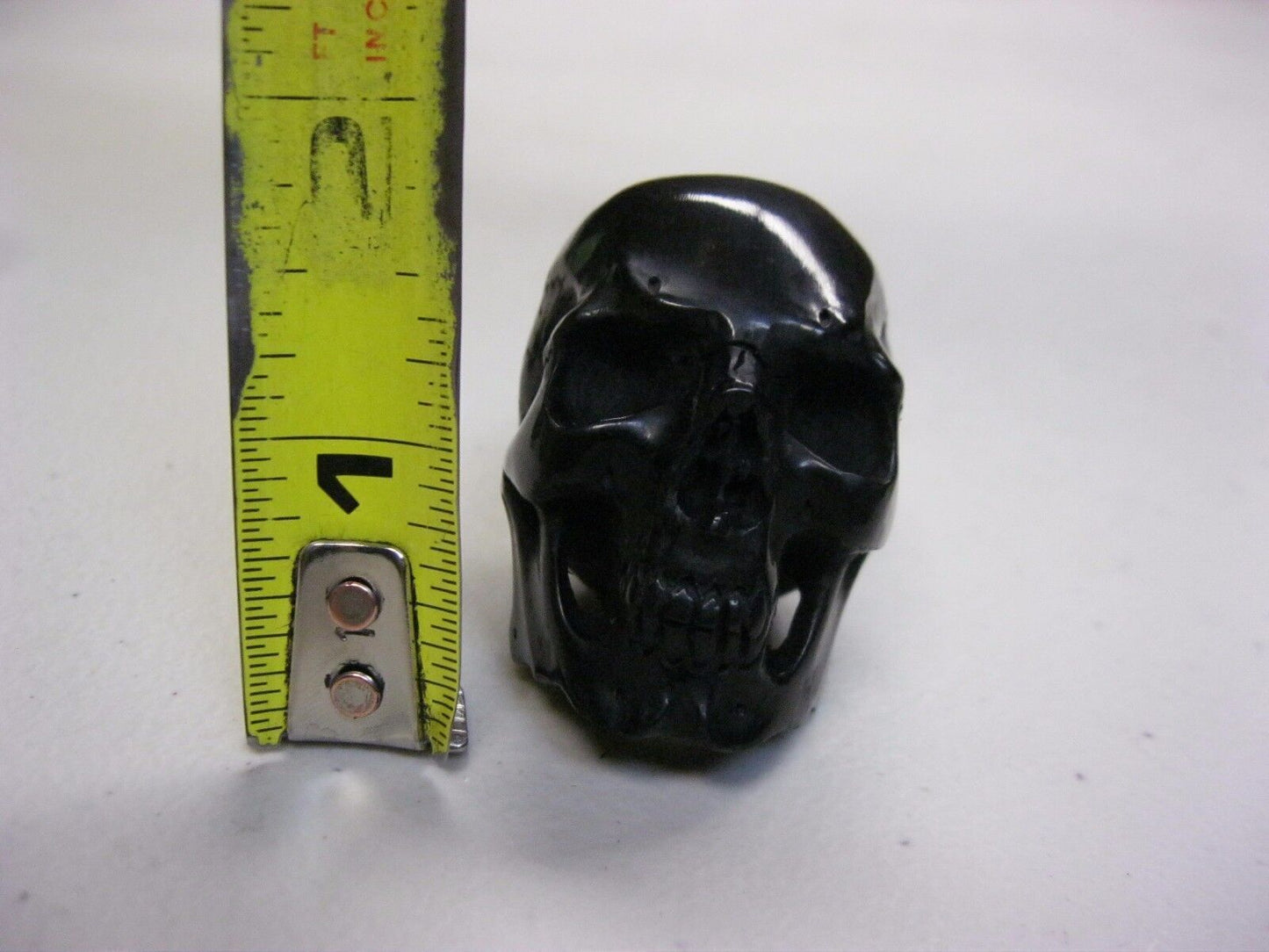 NATURAL WATER BUFFALO HORN HAND CARVED HUMAN SKULL APPROX 1-1/2"