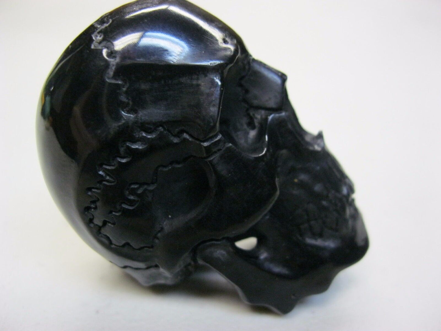 NATURAL WATER BUFFALO HORN HAND CARVED TALL HUMAN SKULL APPROX 2"