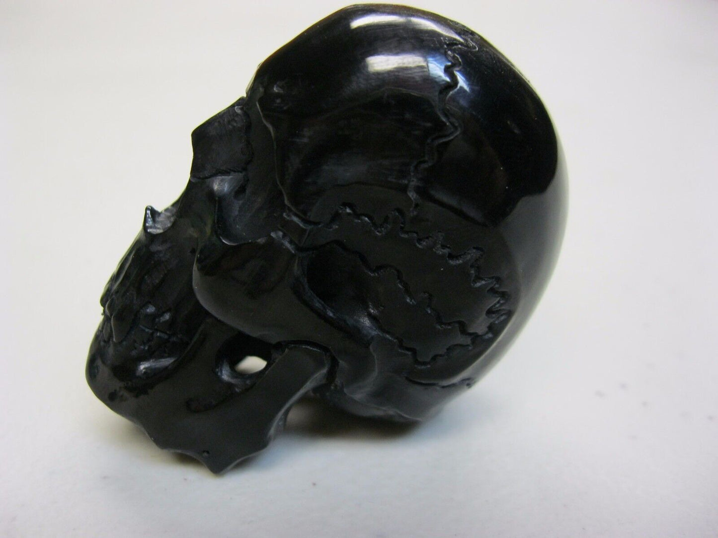 NATURAL WATER BUFFALO HORN HAND CARVED TALL HUMAN SKULL APPROX 2"