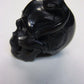 NATURAL WATER BUFFALO HORN HAND CARVED HUMAN SKULL AND SNAKE APPROX 1-1/2"