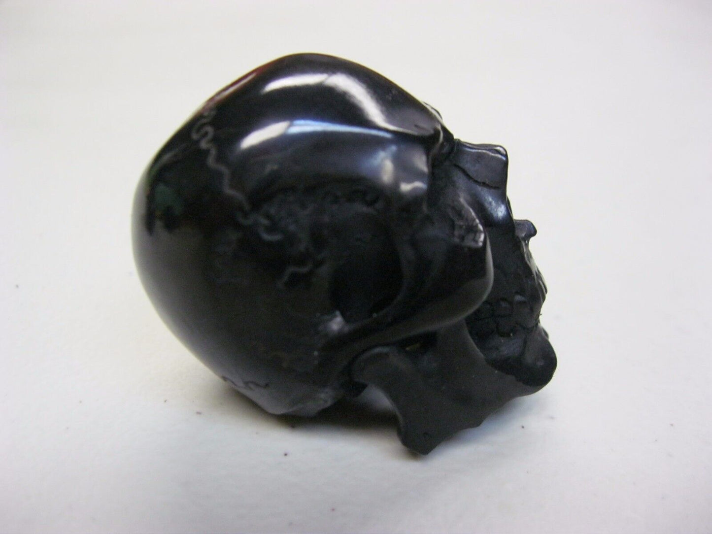 NATURAL WATER BUFFALO HORN HAND CARVED HUMAN SKULL APPROX 1-1/2"