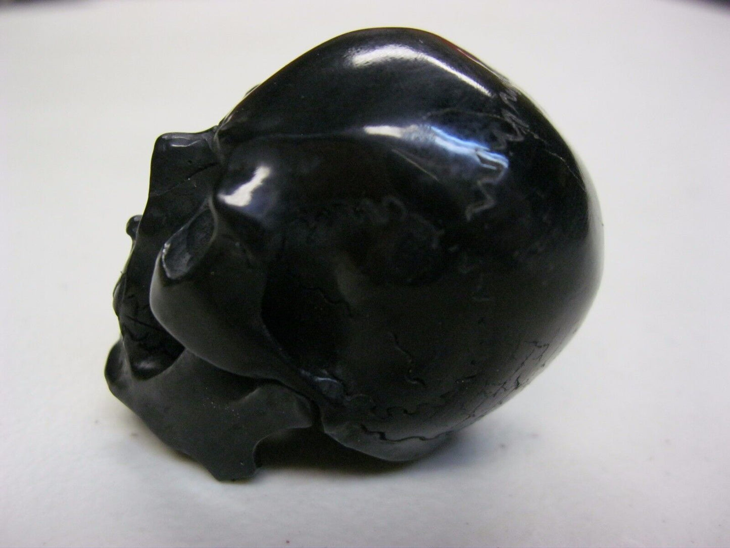 NATURAL WATER BUFFALO HORN HAND CARVED HUMAN SKULL APPROX 1-1/2"